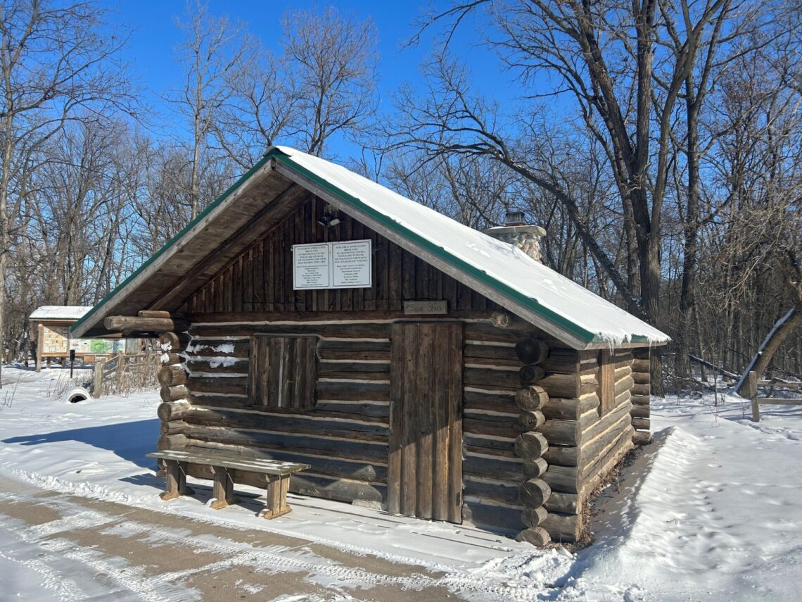 Picture of a log building called the sugar shack