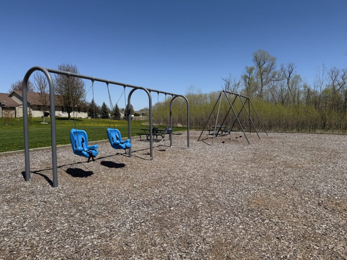 Picture of swing set with blue swings