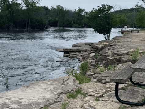 Picture of the water by Quarry Point Park and two picnic tables