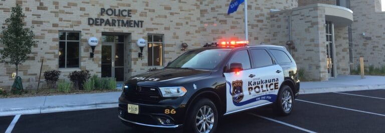 Police vehicle sits outside the police department.