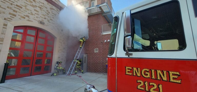 Firefighters practice putting out a fire at the Fire Department