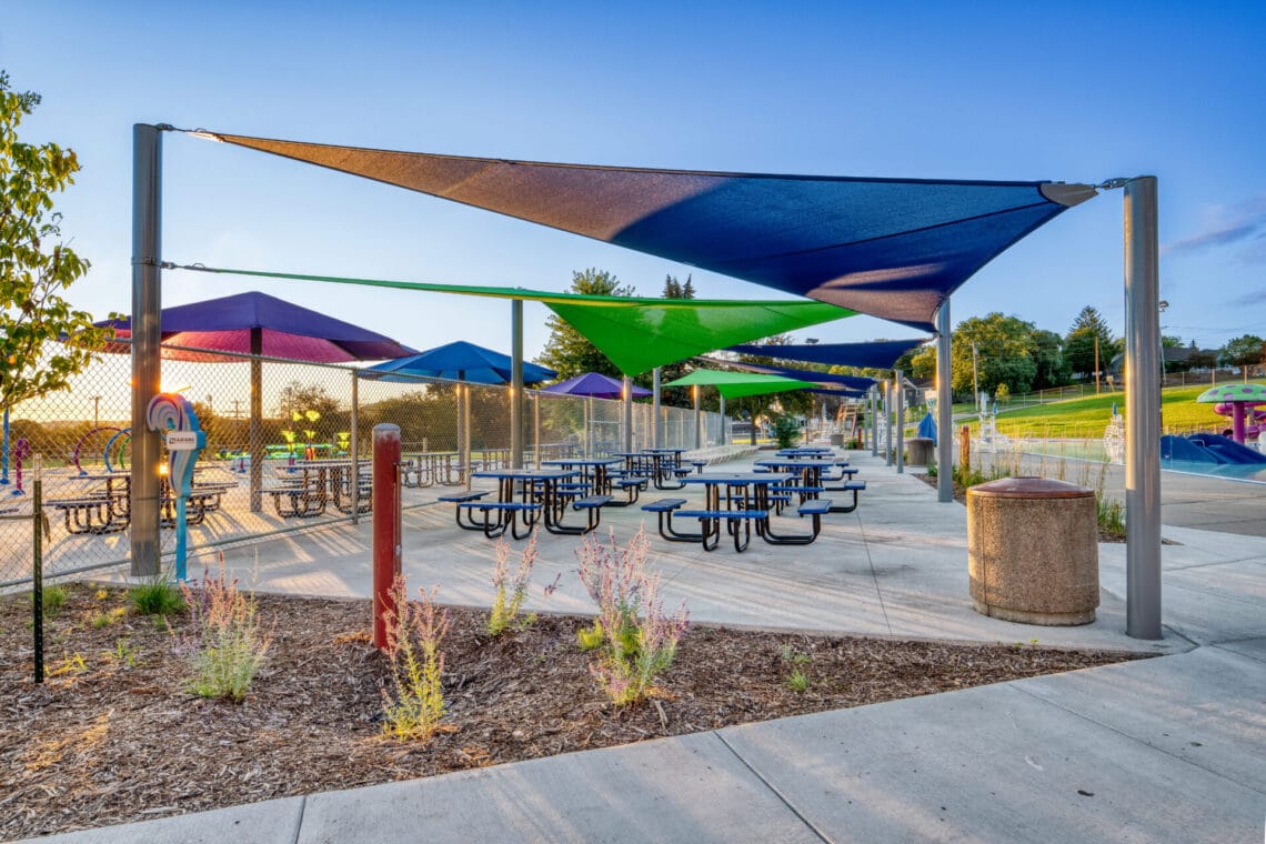 Shade structures and picnic tables at the City of Kaukauna Aquatic Center