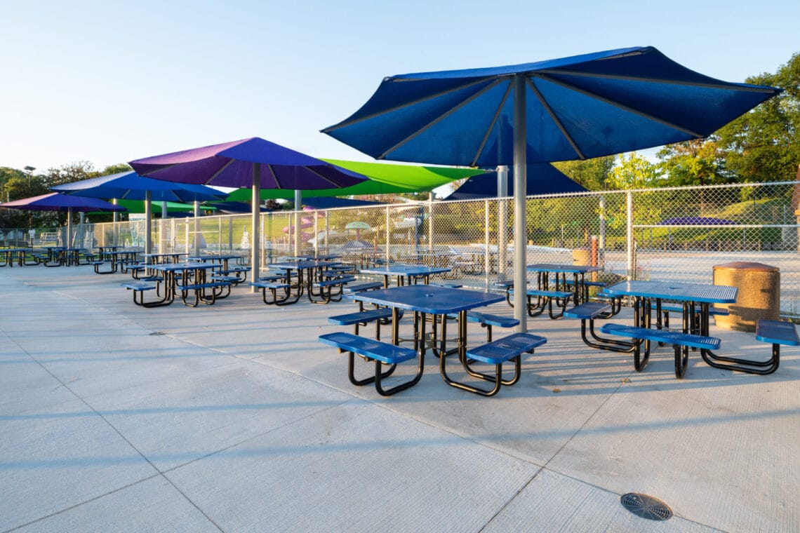 Shade structures and picnic tables at the City of Kaukauna Aquatic Center
