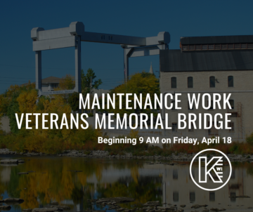 Announcement of maintenance work at Veterans Memorial Bridge with a start time of 9 AM on Friday, April 18. The image shows the bridge with a clear sky and reflective water in the foreground.