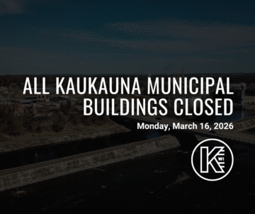 The image displays a darkened cityscape with a river in the foreground. Overlaid text states, 