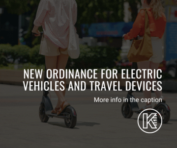 Two people ride electric scooters outdoors on a sunny day. Text overlay reads, 