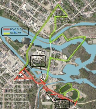A detailed map of a town shows the blocked roads. Red lines indicate road closures at key intersections. Landmarks like roads and rivers are visible, providing context for navigation.